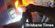 Dramatic vision shows moment officers rescue elderly woman in wheelchair from burning home