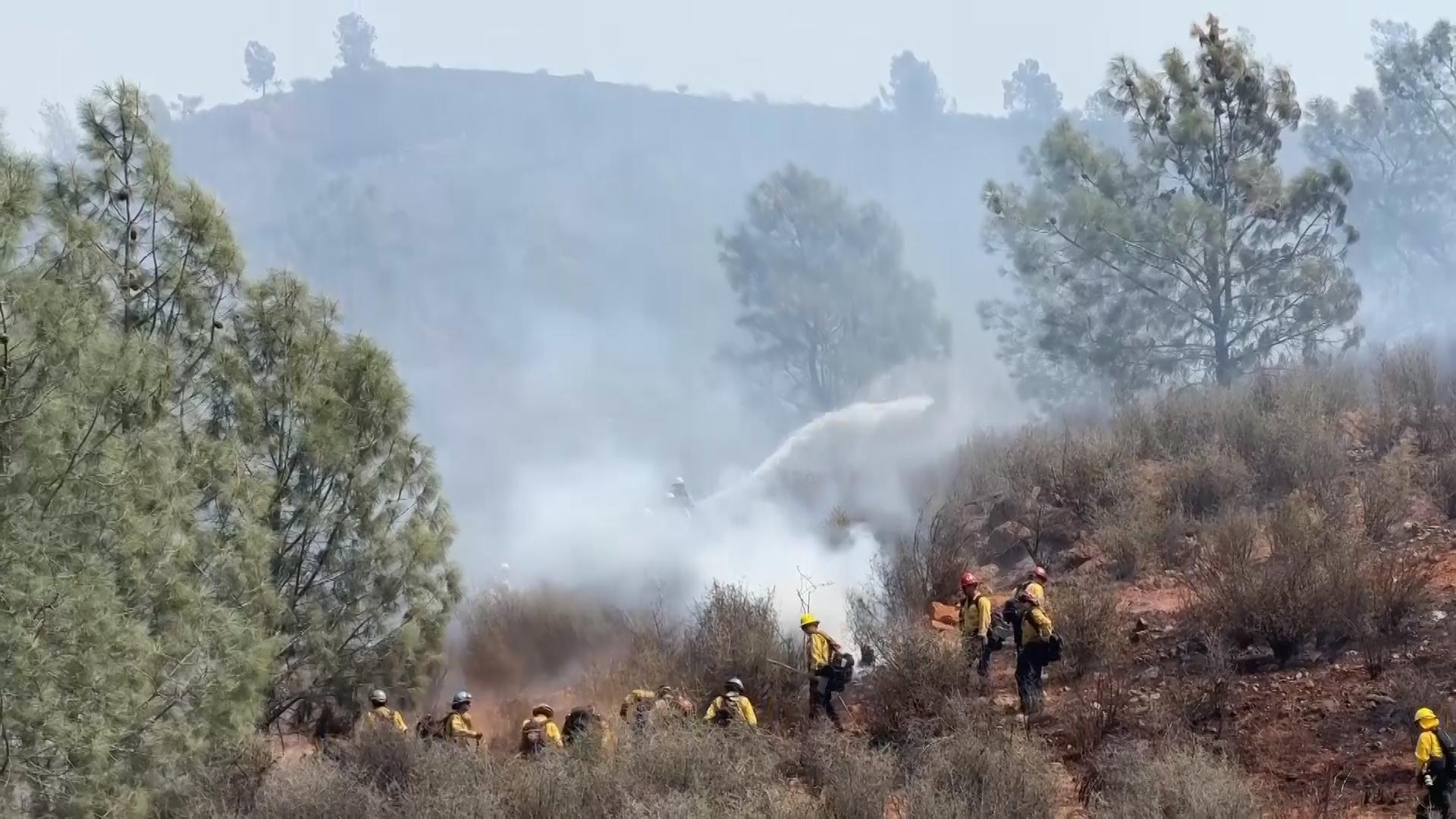 Firefighters battle wildfire devastating historic California town; homes burn in lightning blaze
