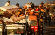 FOTOS: Palestinos abandonan la Ciudad de Gaza ante los intensos ataques israelíes