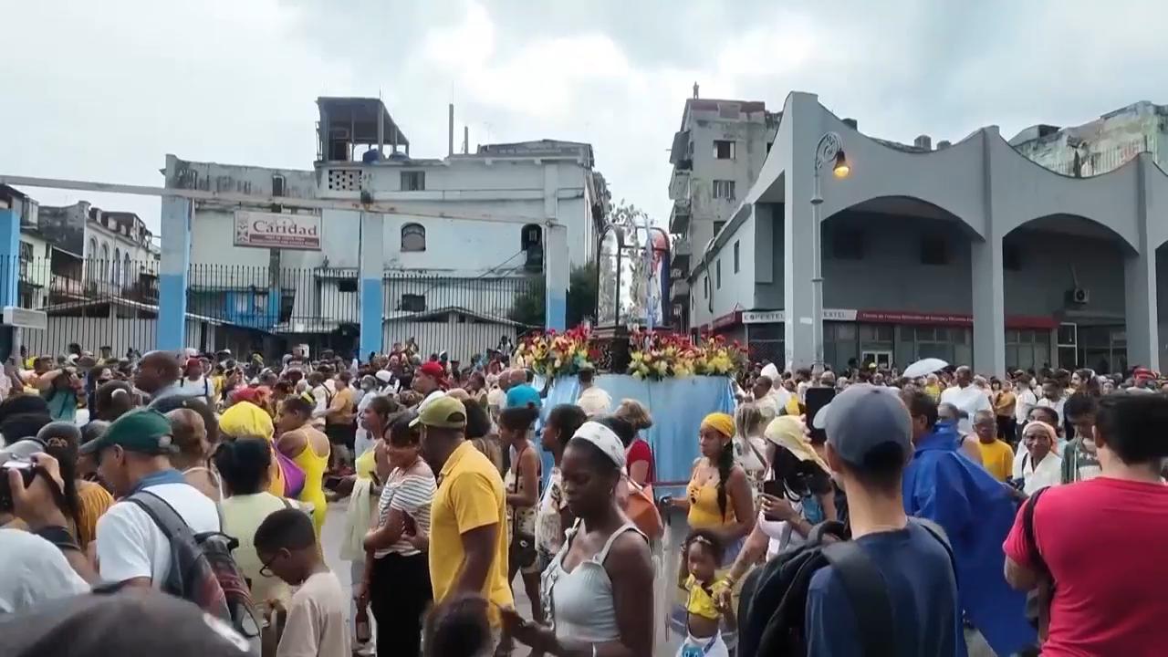 Cubans celebrate the day of their patron saint with a procession through Havana