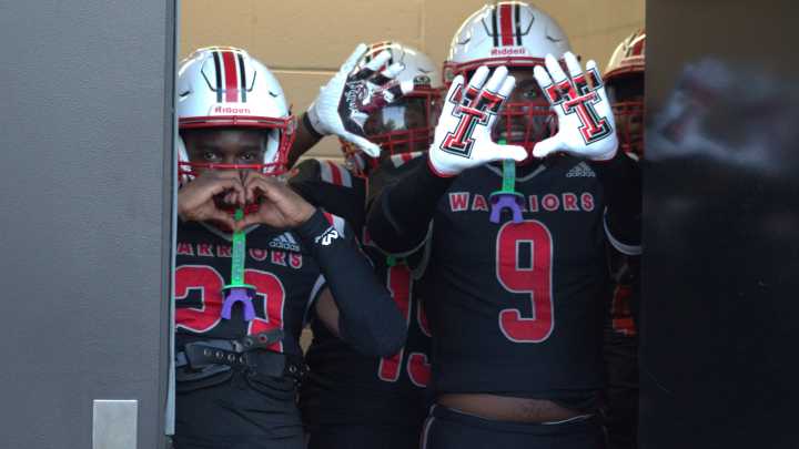 See images of the Jenkins high school football team playing at Liberty Co.