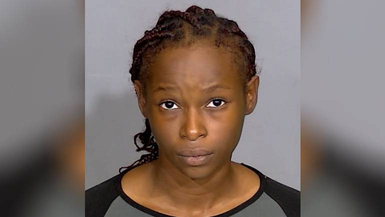 Woman arrested in connection with 2021 double murder