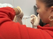 Who can get a COVID vaccination in Rhode Island? 