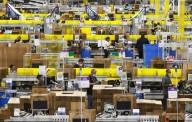 Amazon bumps pay, lowers health insurance costs for warehouse workers
