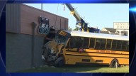 Four taken to hospital after school bus slams into building Thursday morning