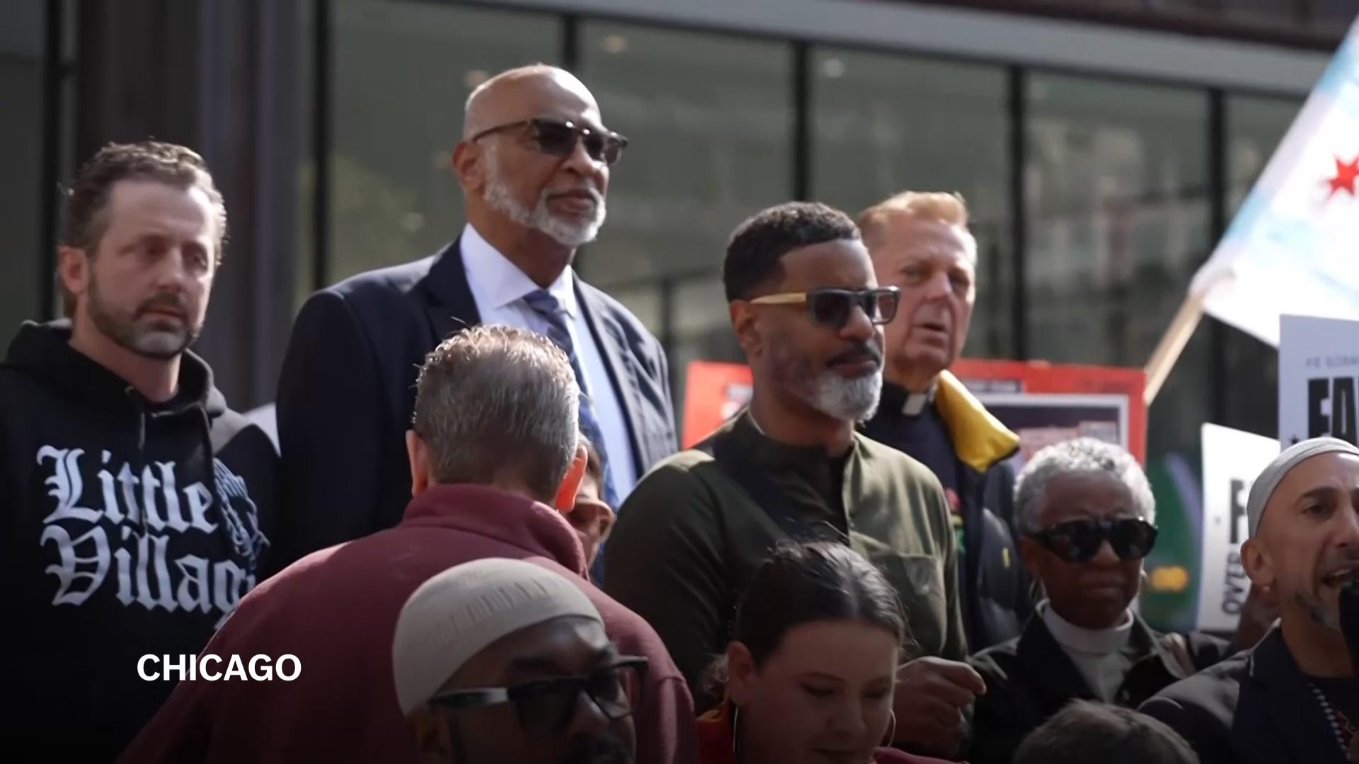 Faith leaders chant 'Faith over fear! We don't need your troops over here!' at rally against Trump