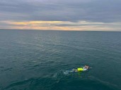 Teacher completes swimming relay honouring Edmund Fitzgerald crew