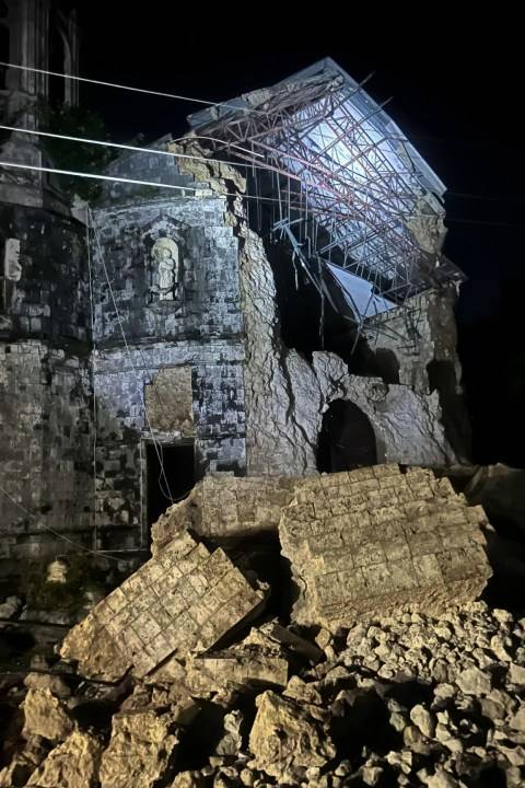 Strong earthquake in central Philippines damages building and sends people out of their homes