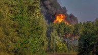 Explosions heard in Lithuania's capital after railcars loaded with liquefied gas catch fire