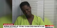 Woman accused of trying to run over man mult. times with car