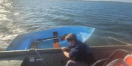 Clinton firefighters rescue person clinging to capsized sailboat