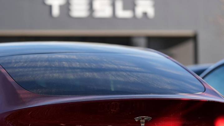 Tesla under investigation after parents say faulty door handles trapped their kids in the back