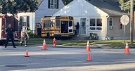 Driver flees after hitting school bus, causing crash into Milwaukee house