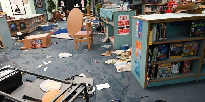 2 boys turned in by their moms after allegedly causing over $50K in damage to school library