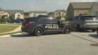 Police fatally shoot man in a burning Ga. house, finding woman dead and others trapped
