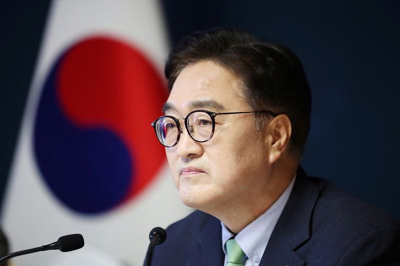 North Korea's Kim and South Korean parliament speaker shake hands, speaker's office says