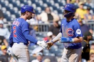 Happ homers as the Cubs clinch first postseason berth since 2020 with an 8