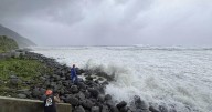 Super typhoon blowing by northern Philippines and Taiwan forces evacuations and closures