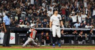 Yanks beat Orioles to stay tied for AL East lead