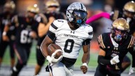 Ankeny Centennial's Javaris Morgan rushes for a touchdown vs. Lincoln