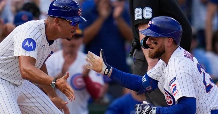 Busch stars as the Cubs beat the Cardinals to clinch the top NL wild card