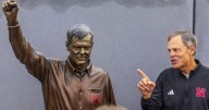 ‘Still blows my mind’: Nebraska honors John Cook with statue at Devaney Center