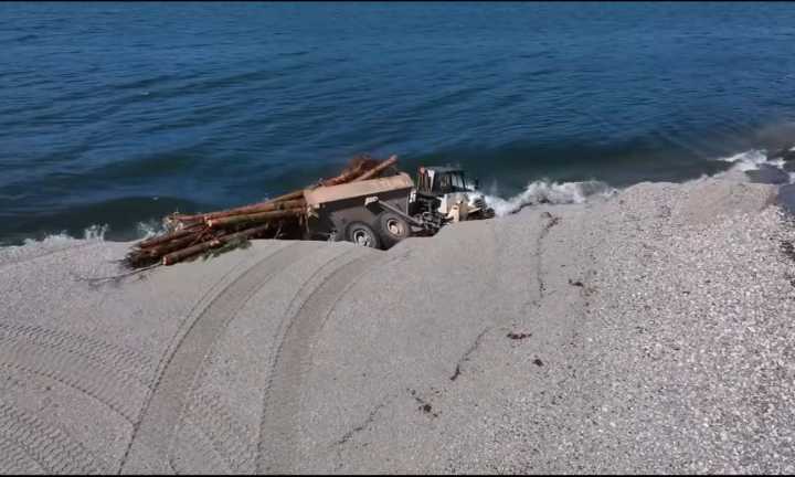 Truck swallowed in shoreline collapse