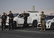 Gunman kills 2 at Israeli-run crossing between West Bank and Jordan. 4 soldiers killed in Gaza
