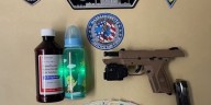 Four arrested after drugs and gun found in home