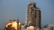 Israel levels Gaza high-rise tower near Palestinian civilian encampment