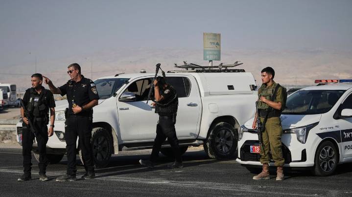Gunman kills 2 at Israeli-run crossing between West Bank and Jordan. 4 soldiers killed in Gaza