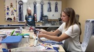 Johnson High School choir boosters craft affordable homecoming mums
