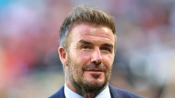 David Beckham debuts hair transformation as he's pictured on solo trip