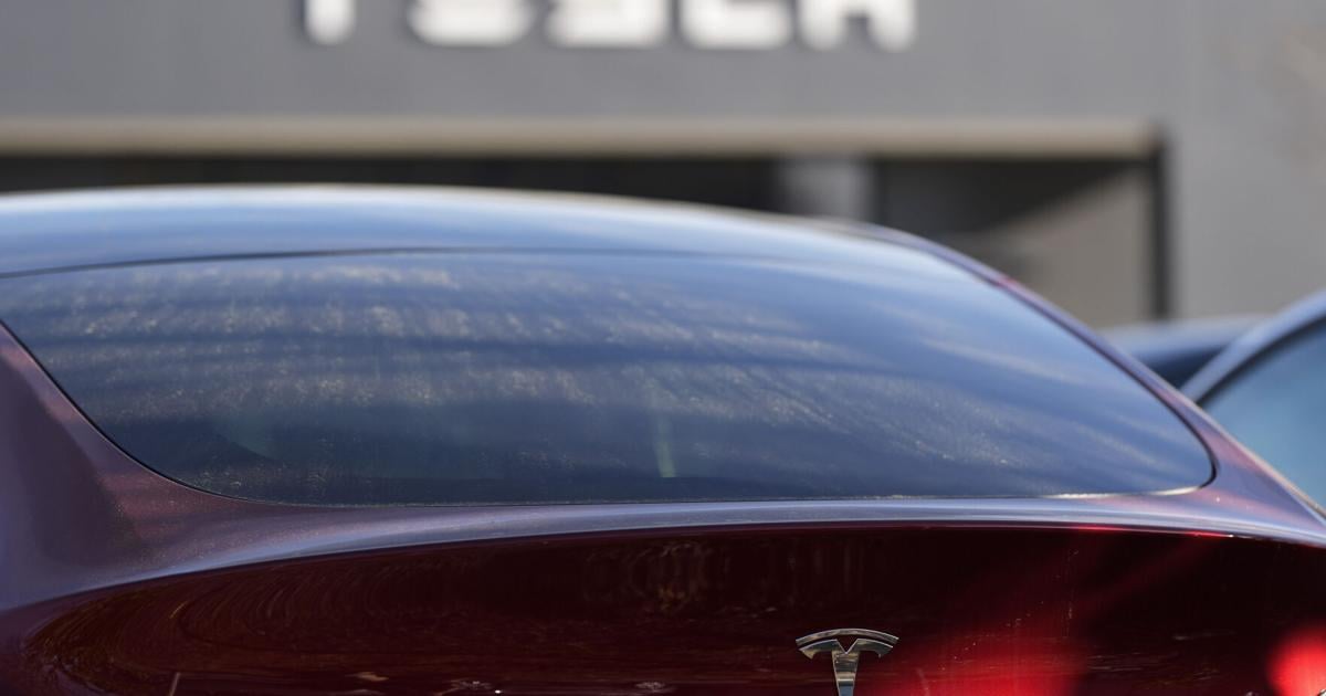 Tesla under investigation after parents say faulty door handles trapped their kids in the back