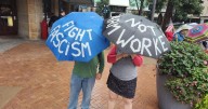 Protesters brave rainy Labor Day to support workers, immigrants