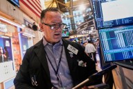 Wall Street rises to more records as Tesla vrooms higher