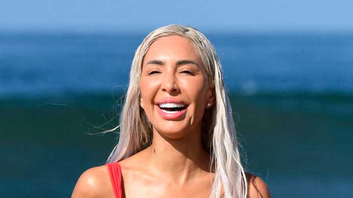 Farrah Abraham runs in sea on vacation in barely-there string thong swimsuit showing her butt and nearly flashing boobs