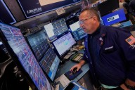 Wall Street rises to more records as Tesla vrooms higher