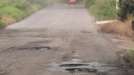 Tlanchinol: Lluvias provocan baches en carretera México