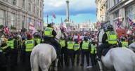 Tommy Robinson supporters hurl bottles and flares at police as 25 arrested over 'violence'