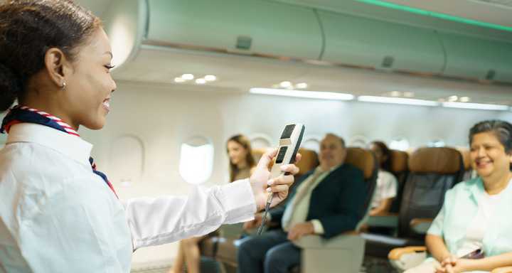 Punk Flight Attendant Gives Mic to Front Row Passengers During Pre