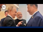 Leaders stand hand-in-hand at Shanghai Cooperation Organization