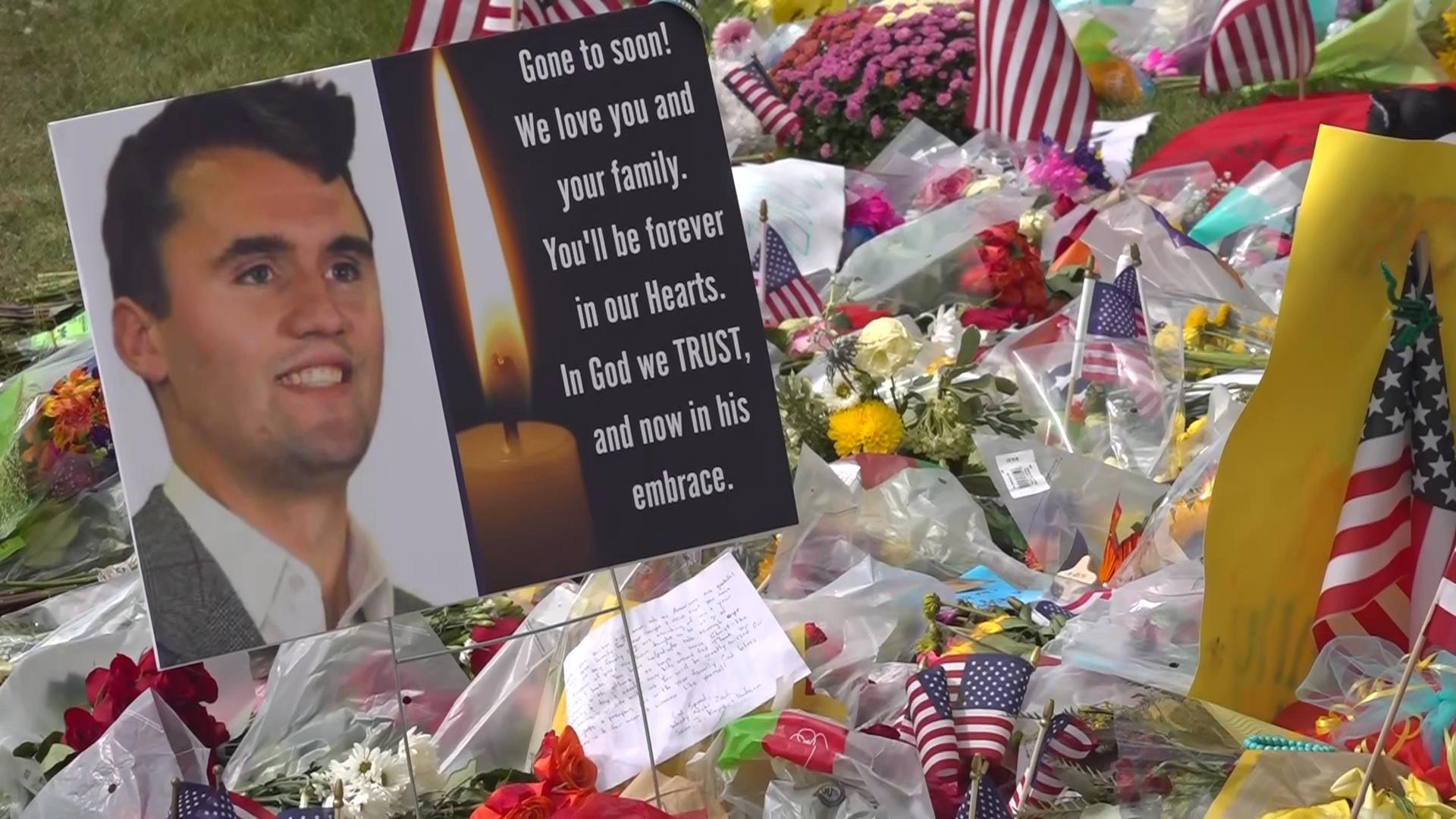 People mourn Charlie Kirk at a memorial set up at Utah Valley University