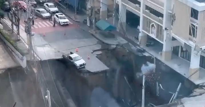 Giant Sinkhole Swallows Three Cars in the Middle of the Street