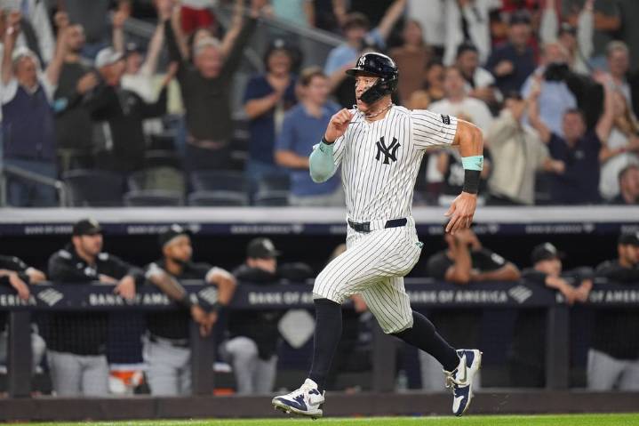 Judge reaches 50 homers for 4th time, hits pair as Yanks tie for AL East lead by beating White Sox