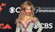 Doja Cat Kicks Off VMAs 2025 Red Carpet Carrying a $6,000 Lipstick Clutch 