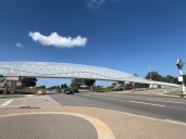 New pedestrian bridge opens over busy 28th Street