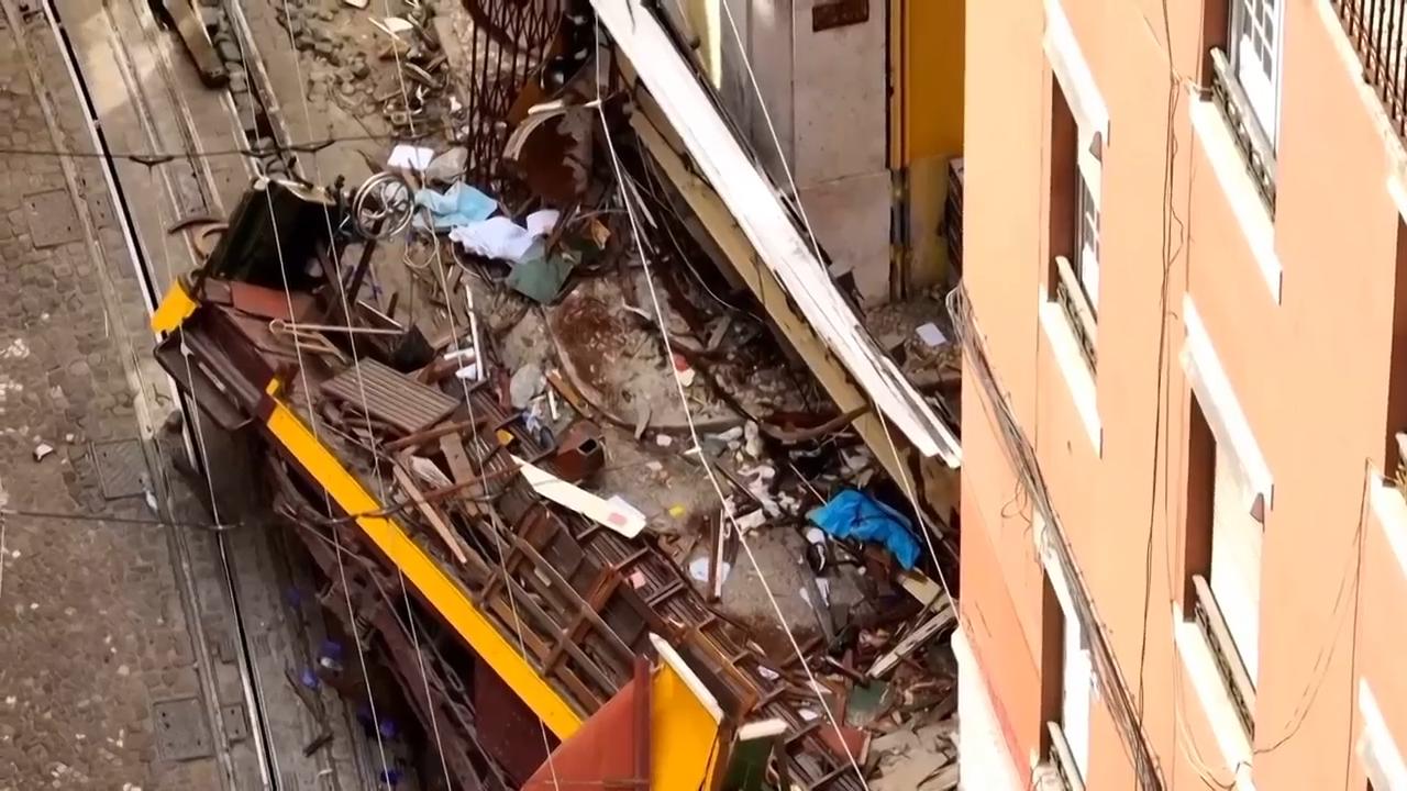 Aerial view of streetcar wreckage in Lisbon as investigation into deadly crash underway