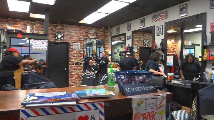 Local barber shop gives free back-to-school supplies and haircuts
