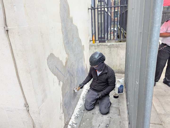 Banksy mural of UK judge hitting protester scrubbed from London court wall